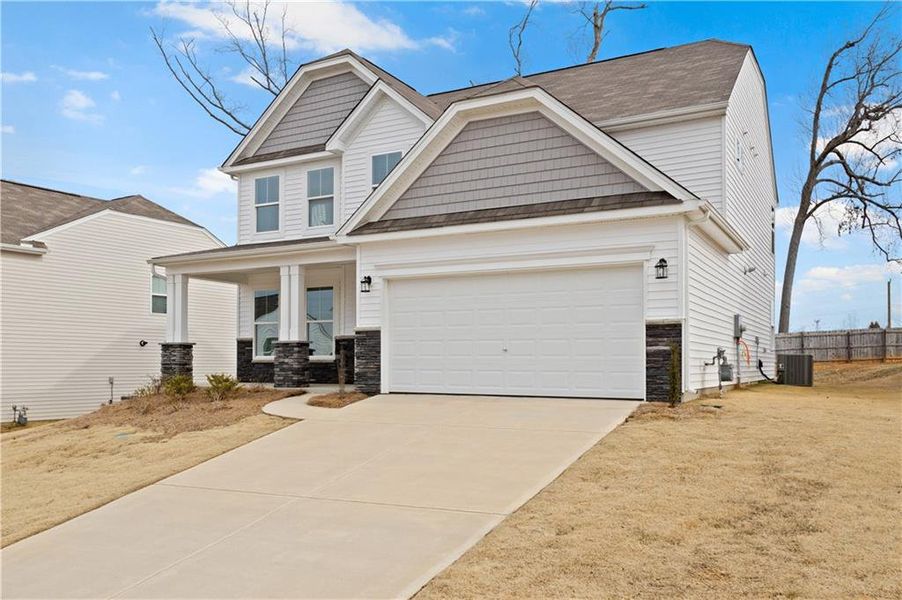 Front exterior of a new home in Twin Lakes, Hoschton, GA, highlighting curb appeal (Image 2).