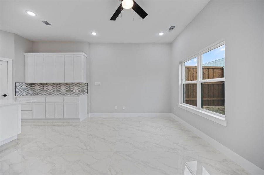 Unfurnished living room with recessed lighting, visible vents, baseboards, and marble finish floor