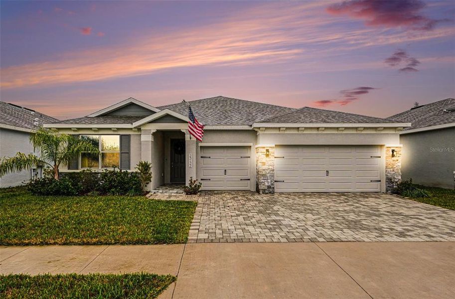 Front exterior of a new home in Willow Reserve, Lutz, FL, highlighting curb appeal (Image 23).
