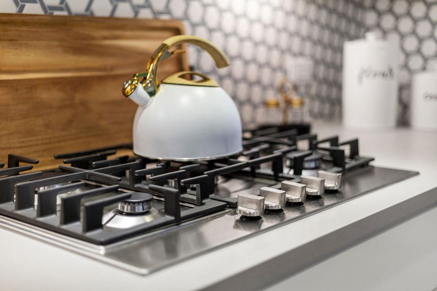 Room details with stainless steel gas cooktop