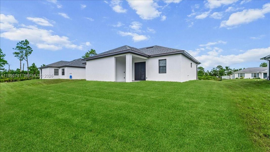 Exterior details and patio area of a home in , Lehigh Acres (Image 30). Exterior details and patio area of a home in , Lehigh Acres (Image 30).