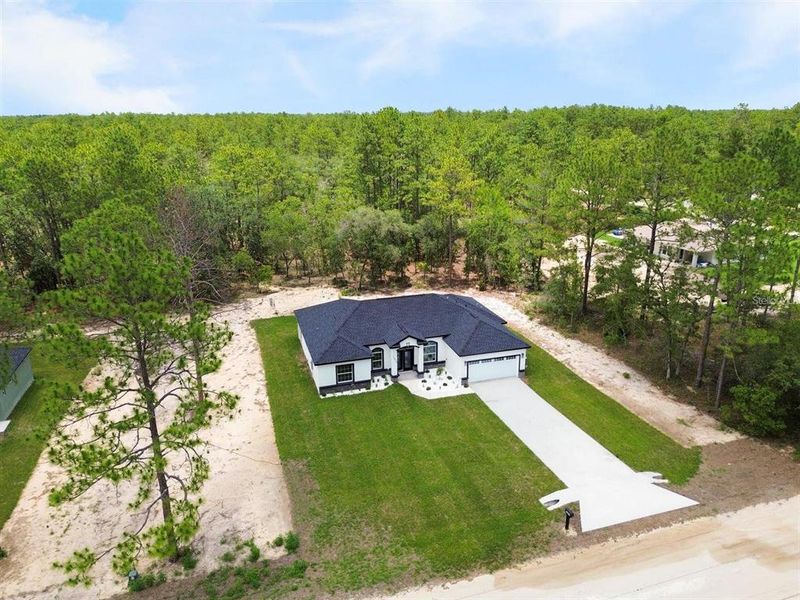 Front exterior of a new home in , Dunnellon, FL, highlighting curb appeal (Image 18).
