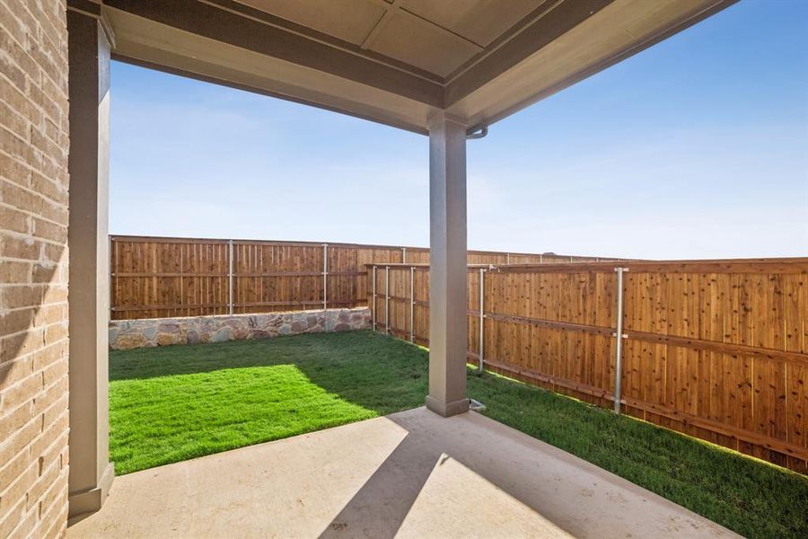 Exterior details and patio area of a home in Creekshaw – Classic, Royse City (Image 3).