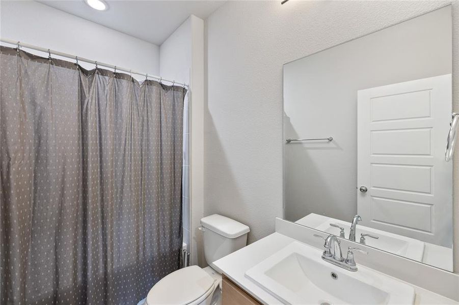 Bathroom featuring toilet and vanity