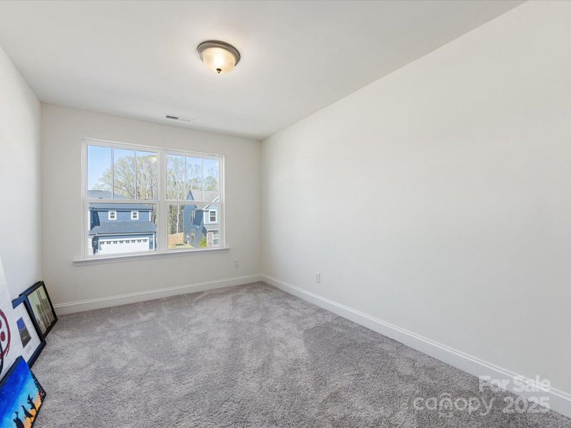 Spacious, unfurnished interior of a new home in Smith Farm, Belmont (Image 18).