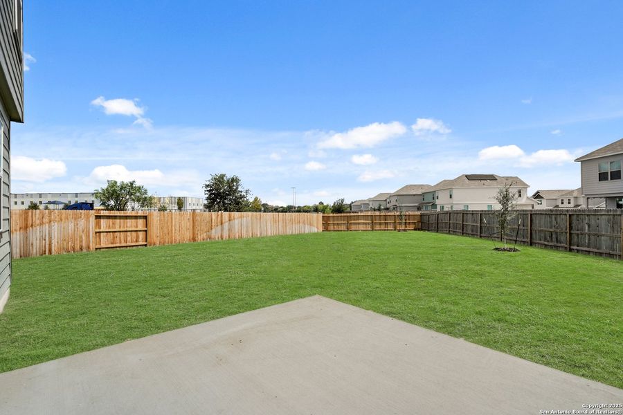 Front exterior of a new home in Melissa Ranch, San Antonio, TX, highlighting curb appeal (Image 2). Front exterior of a new home in Melissa Ranch, San Antonio, TX, highlighting curb appeal (Image 2).