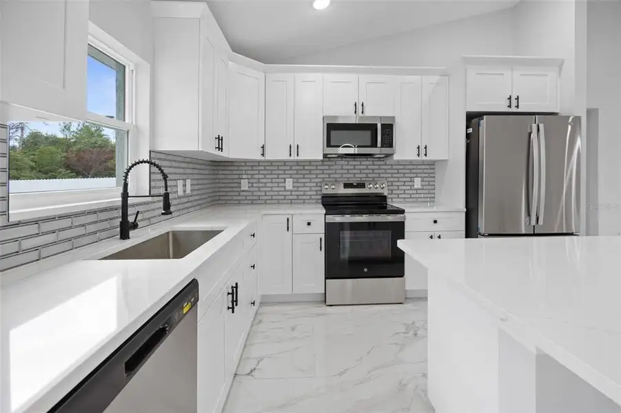 Furnished interior view inside a new home in , Dunnellon (Image 8).