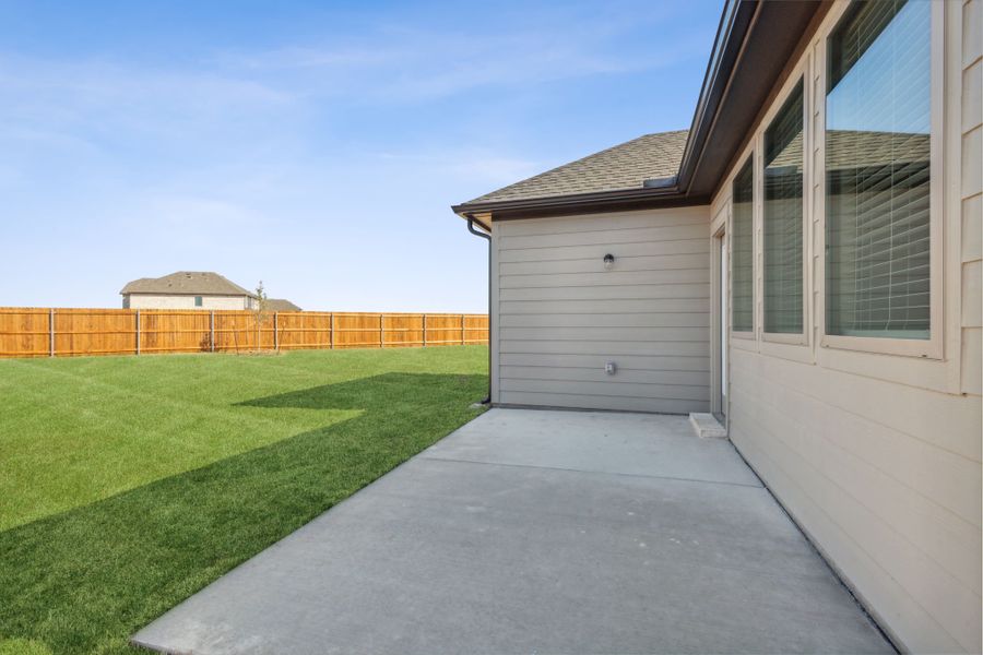 Patio in the Willow home plan by Trophy Signature Homes – REPRESENTATIVE PHOTO