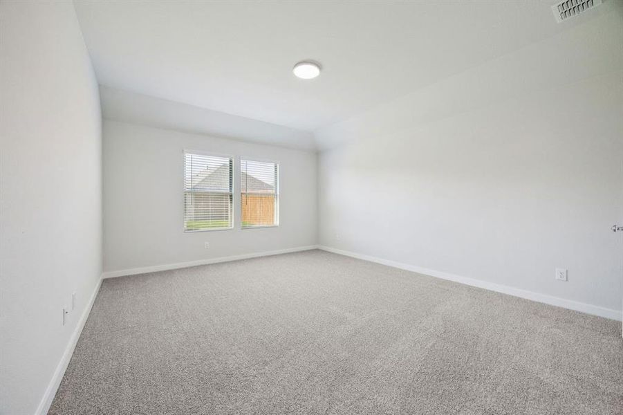 Primary Suite in the Heisman home plan by Trophy Signature Homes – REPRESENTATIVE PHOTO