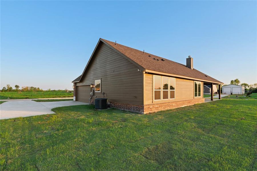 Front exterior of a new home in Oak Valley, Oak Ridge, TX, highlighting curb appeal (Image 2).