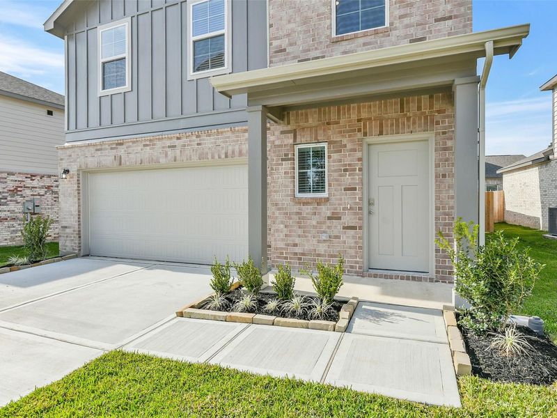 Exterior details and patio area of a home in Lakes at Black Oak, Magnolia (Image 3).