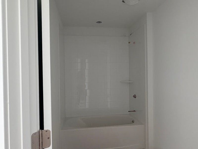 In-progress construction of a new home in Whaley Grove Townhomes, St. Cloud, FL (Image 12).