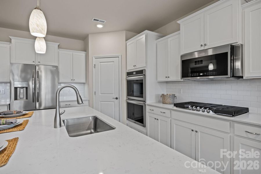 Upgraded Frigidaire Gallery appliances include the double wall oven and fully programmable state-of-the-art microwave, diswasher and built-in gas range.