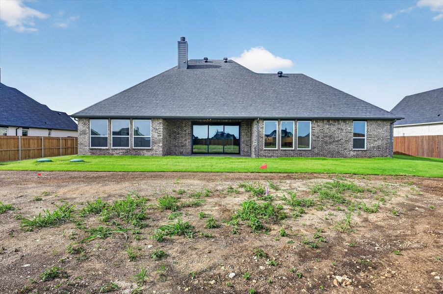 Front exterior of a new home in Coyote Crossing, Godley, TX, highlighting curb appeal (Image 23). Front exterior of a new home in Coyote Crossing, Godley, TX, highlighting curb appeal (Image 23).