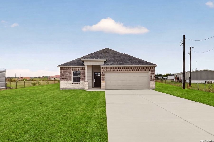 Front exterior of a new home in , Natalia, TX, highlighting curb appeal (Image 17). Front exterior of a new home in , Natalia, TX, highlighting curb appeal (Image 17).
