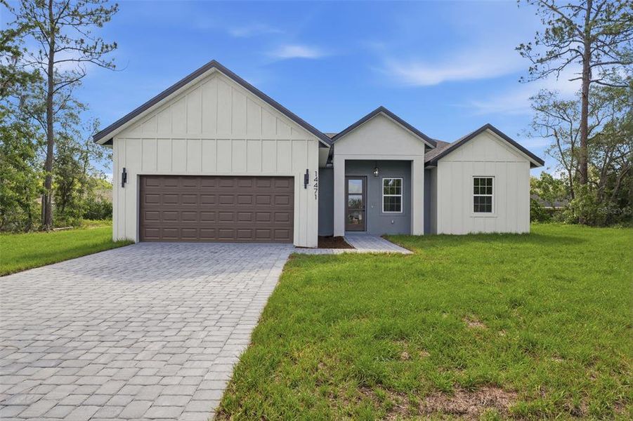 Front exterior of a new home in , Ocala, FL, highlighting curb appeal (Image 2). Front exterior of a new home in , Ocala, FL, highlighting curb appeal (Image 2).