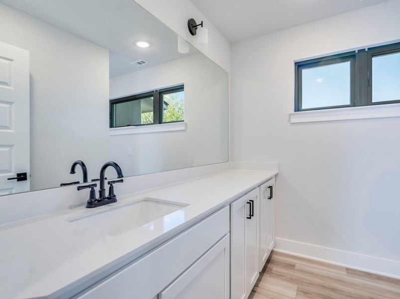 Upstairs' full bathroom with tub-shower combo