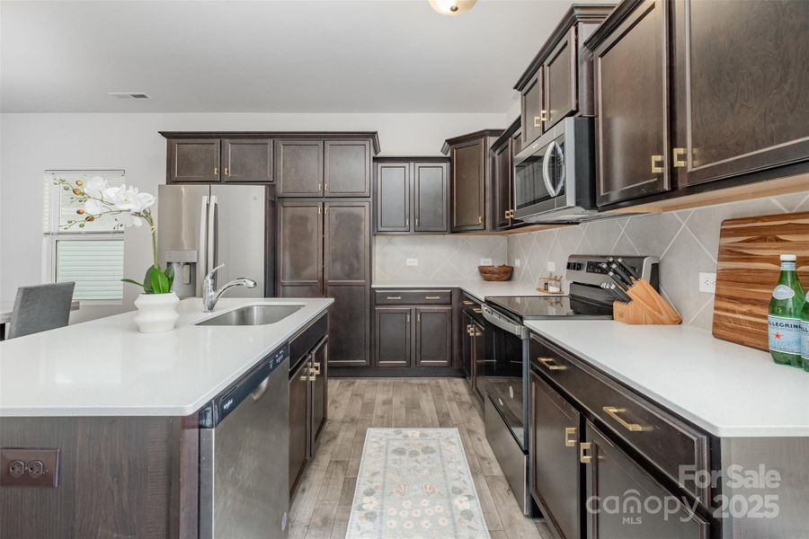 Spacious kitchen with quartz counters