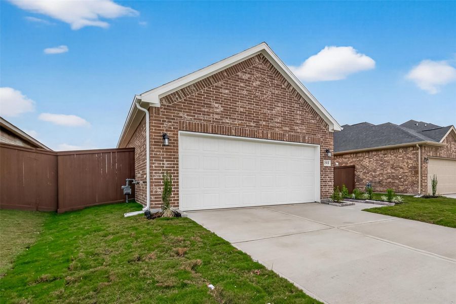 Front exterior of a new home in Enclave at Willis, Willis, TX, highlighting curb appeal (Image 19).