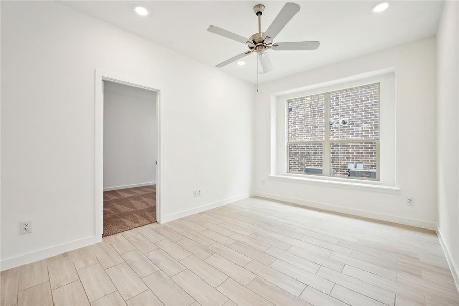 Spare room featuring light hardwood / wood-style flooring and ceiling fan