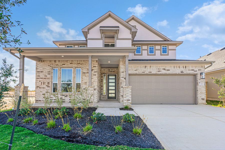 Front exterior of a new home in Lariat, Liberty Hill, TX, highlighting curb appeal (Image 29).