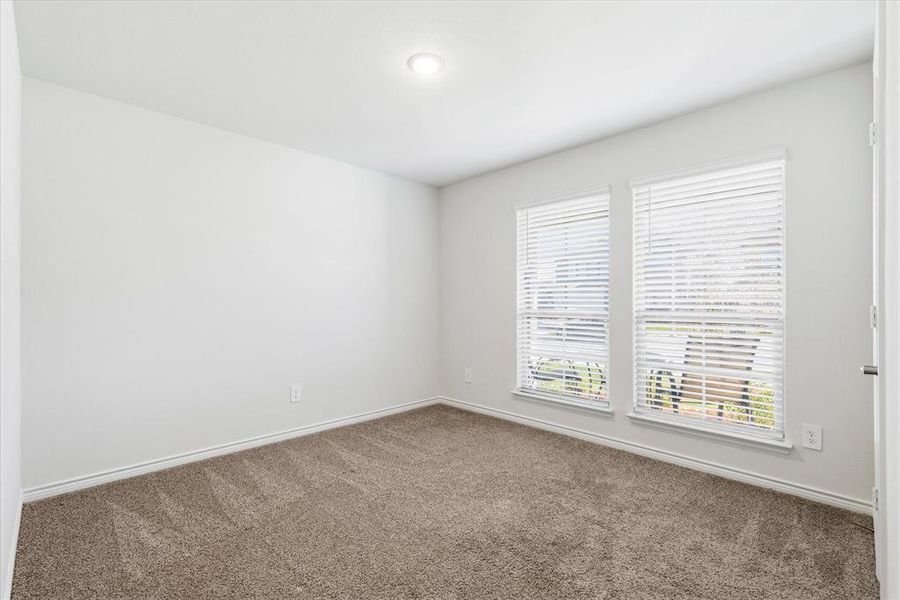 Front bedroom—one of four spacious bedrooms in the home.