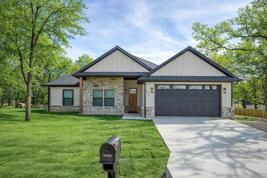 Front exterior of a new home in , Runaway Bay, TX, highlighting curb appeal (Image 2). Front exterior of a new home in , Runaway Bay, TX, highlighting curb appeal (Image 2).