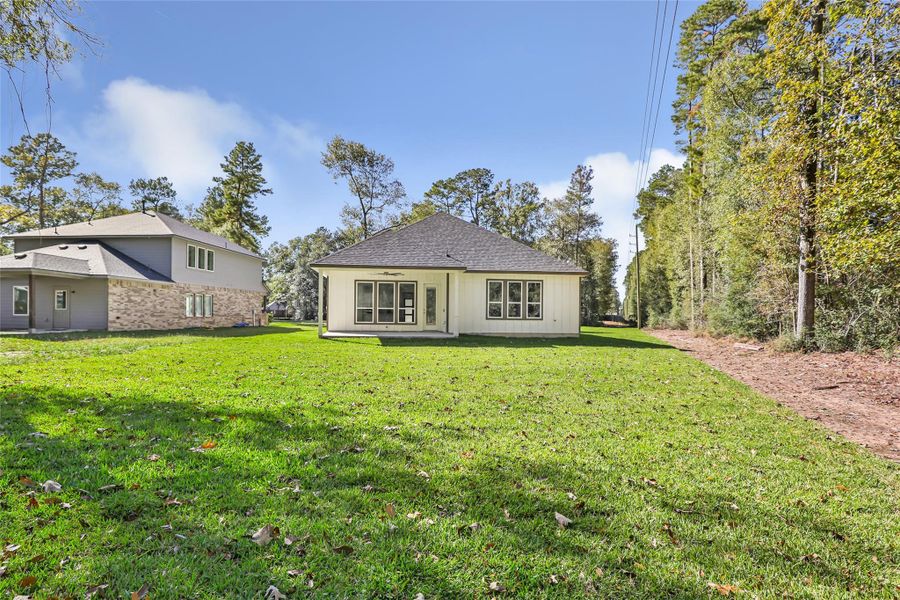 Exterior details and patio area of a home in , New Caney (Image 24).