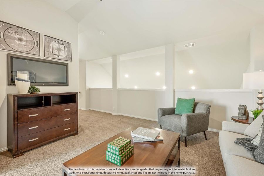 Living room with vaulted ceiling, carpet flooring, wood dresser with TV, and gray accent chair