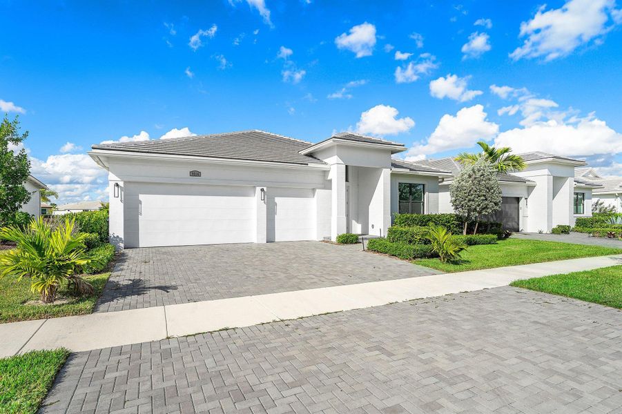 Front exterior of a new home in , Port St. Lucie, FL, highlighting curb appeal (Image 19).