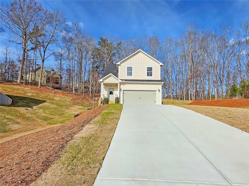 Front exterior of a new home in , Gainesville, GA, highlighting curb appeal (Image 22).