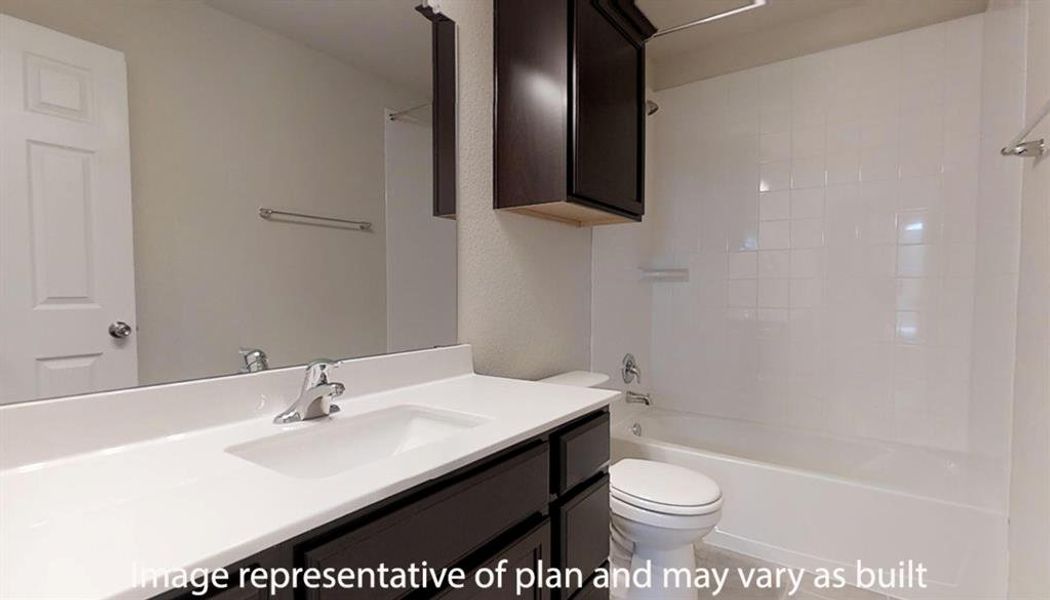 Full bath featuring vanity and bathing tub / shower combination Full bath featuring vanity and bathing tub / shower combination