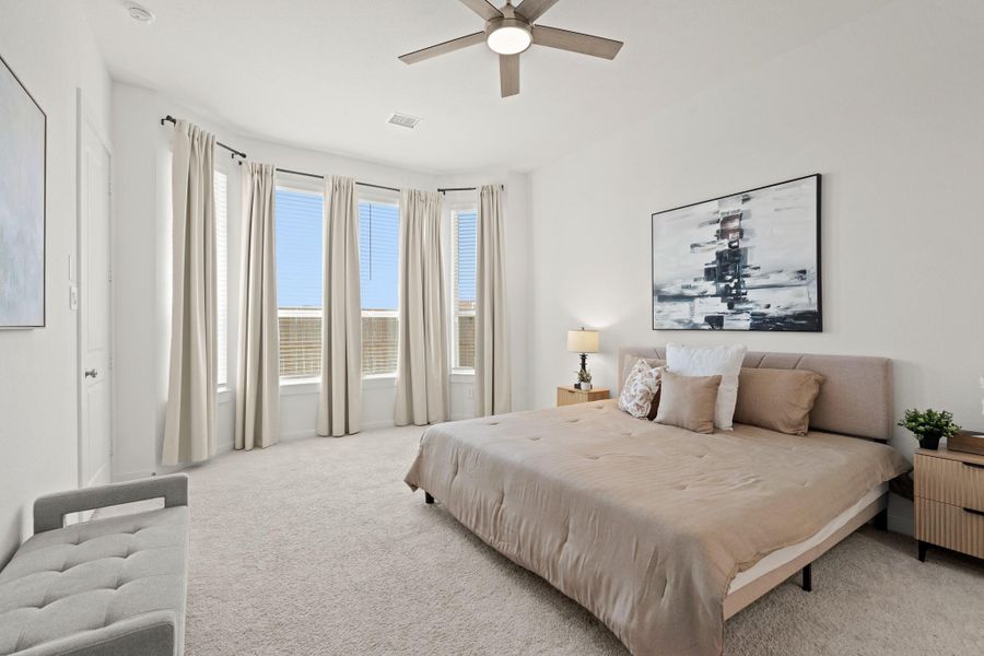 The primary bedroom welcomes you with plush carpet, bright natural light, and an upgraded bay window with a perfect view of the serene yard. It sits at the back of the home offering additional privacy and tranquility!
