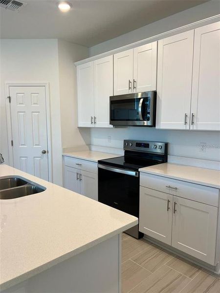 Furnished interior view inside a new home in The Meadow at Crossprairie Bungalows, St. Cloud (Image 3).