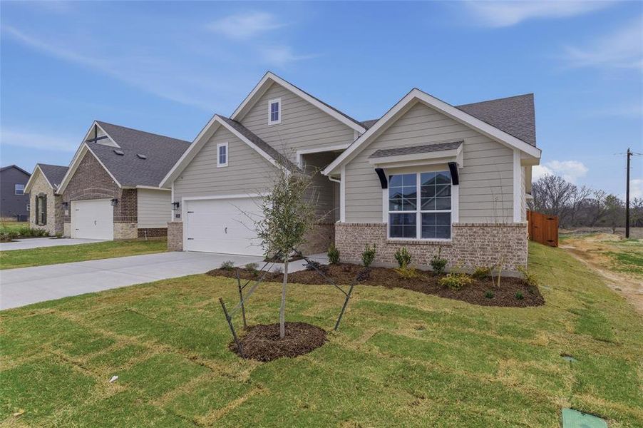 Front exterior of a new home in Covenant Park, Springtown, TX, highlighting curb appeal (Image 15).