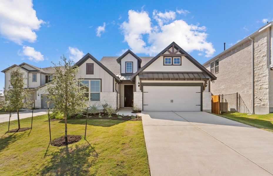 Front exterior of a new home in Saddleback at Santa Rita Ranch, Liberty Hill, TX, highlighting curb appeal (Image 2). Front exterior of a new home in Saddleback at Santa Rita Ranch, Liberty Hill, TX, highlighting curb appeal (Image 2).