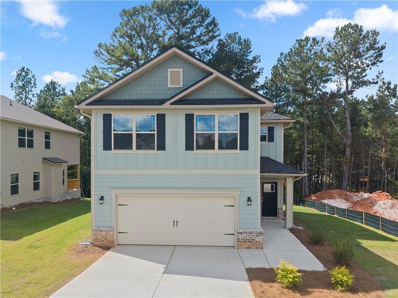 Front exterior of a new home in Magnolia Villas, Cornelia, GA, highlighting curb appeal (Image 26). Front exterior of a new home in Magnolia Villas, Cornelia, GA, highlighting curb appeal (Image 26).