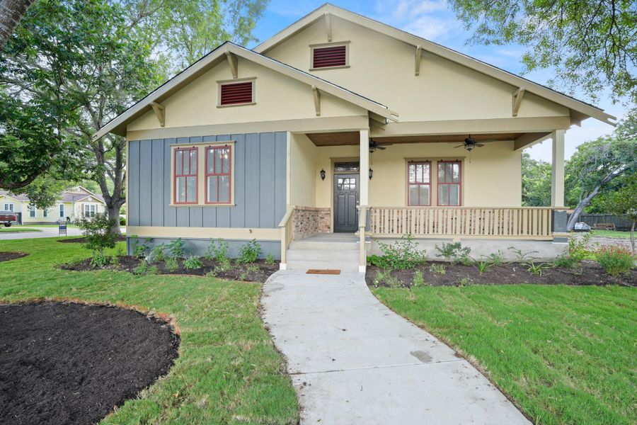 A graceful home with a welcoming front porch, fresh landscaping, and inviting architectural details. A graceful home with a welcoming front porch, fresh landscaping, and inviting architectural details.