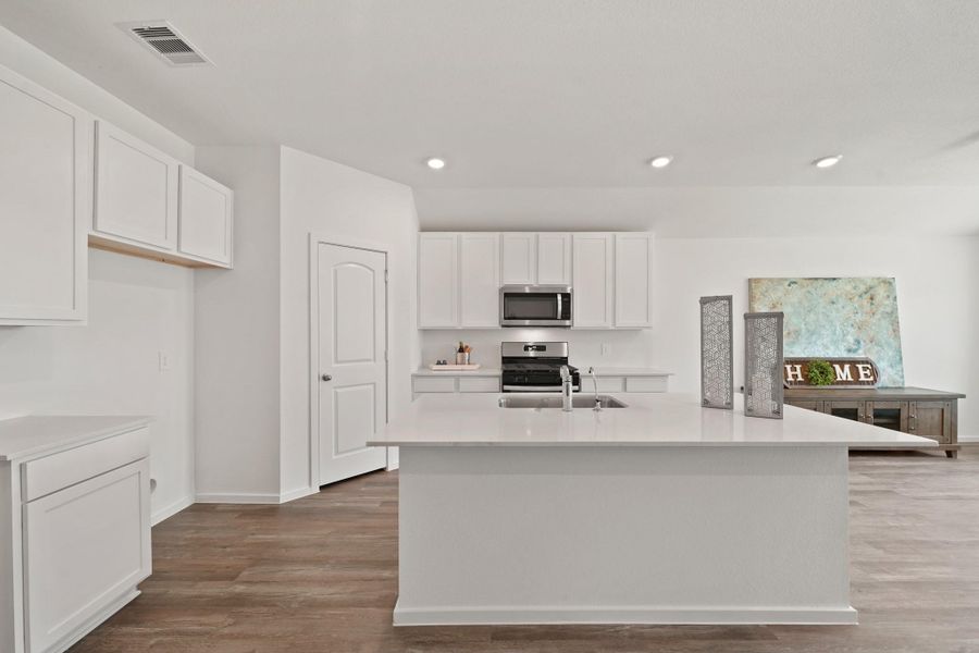 Furnished interior view inside a new home in Sunterra Lakes, Katy (Image 7).