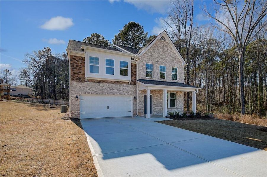 Front exterior of a new home in Burchwood, Stockbridge, GA, highlighting curb appeal (Image 16).