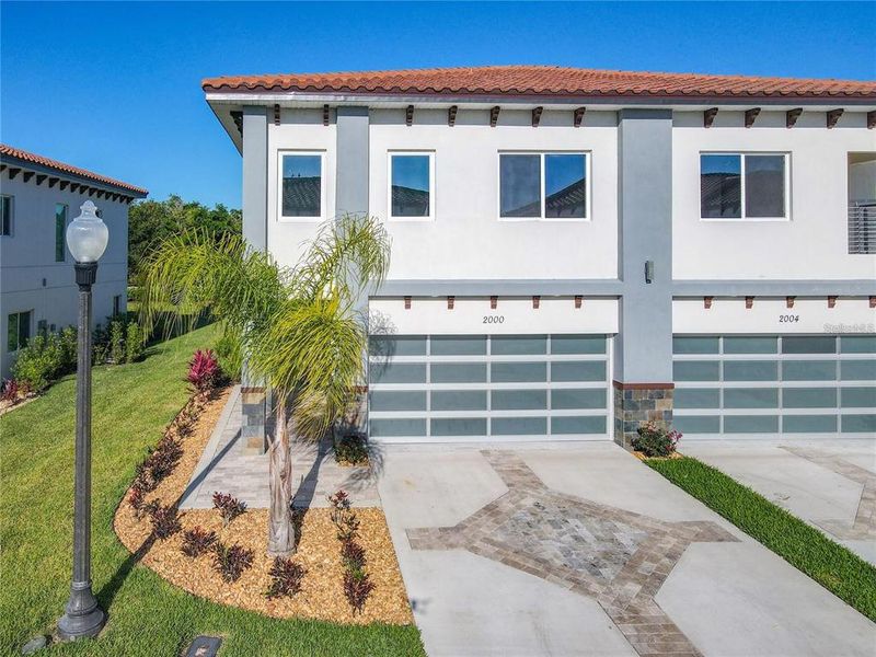 Front exterior of a new home in , Davenport, FL, highlighting curb appeal (Image 24).