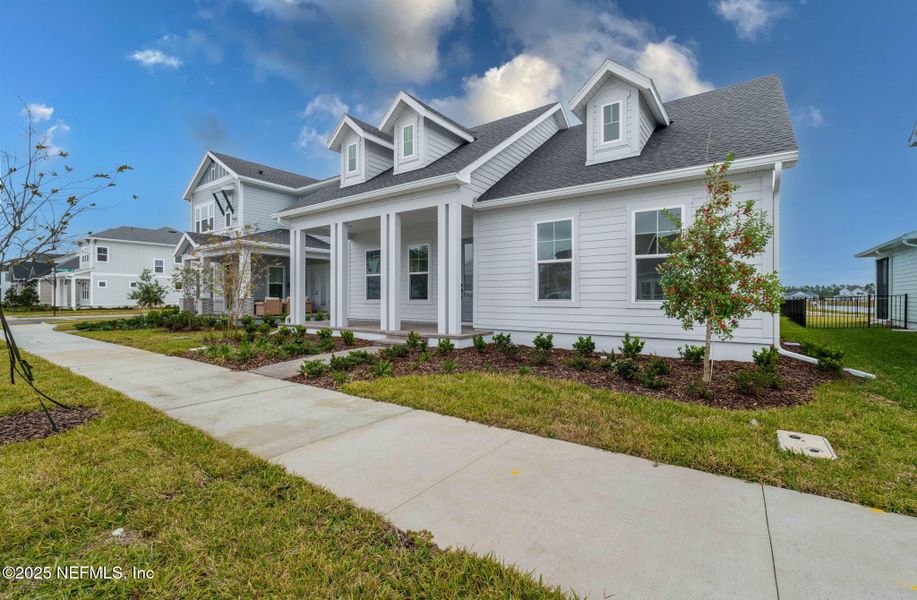 Front exterior of a new home in Seven Pines 50' Rear Entry, Jacksonville, FL, highlighting curb appeal (Image 27).