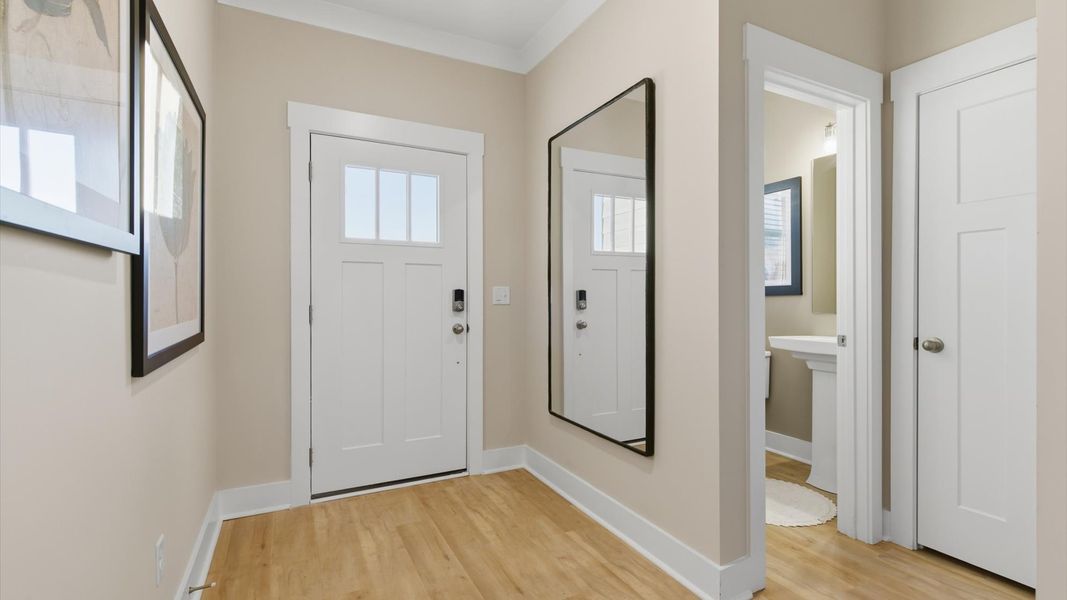 Stylish foyer of the Lawson floorplan with hardwood flooring and tasteful architectural detail in a superior layout in SC