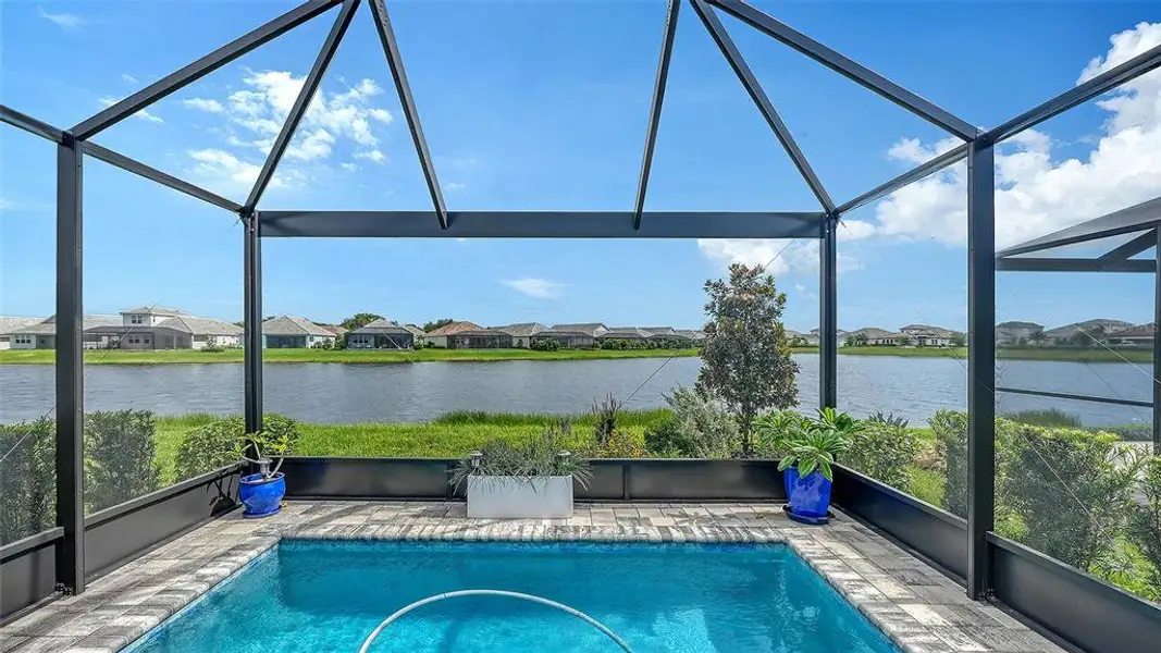 Exterior details and patio area of a home in LakeHouse Cove at Waterside, Sarasota (Image 29). Exterior details and patio area of a home in LakeHouse Cove at Waterside, Sarasota (Image 29).
