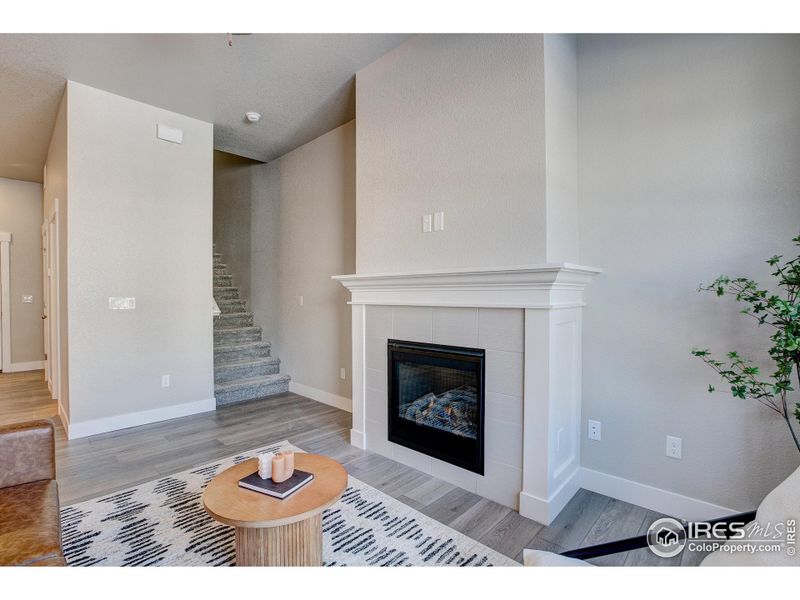 Living Room with gas fireplace- finishes may vary.