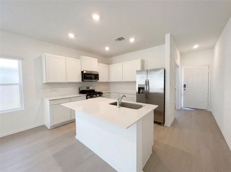 Furnished interior view inside a new home in The Colony, Bastrop (Image 6).