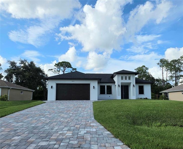 Front exterior of a new home in , North Port, FL, highlighting curb appeal (Image 7).