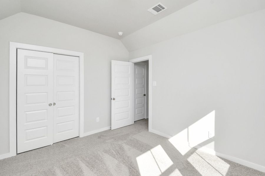 Generously sized secondary bedrooms, complete with spacious closets and soft,inviting carpeting. Enjoy abundant natural light streaming in through the largewindows, complemented by privacy blinds for your personal sanctuary. Sample photo of completed home with similar floor plan. Actual colors and selections may vary.