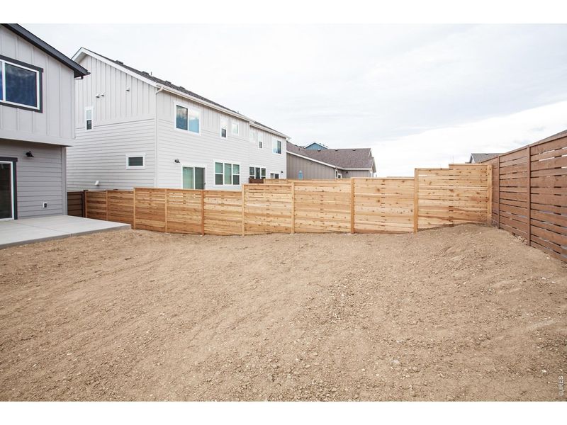 Exterior details and patio area of a home in Wilson Commons, Loveland (Image 3).