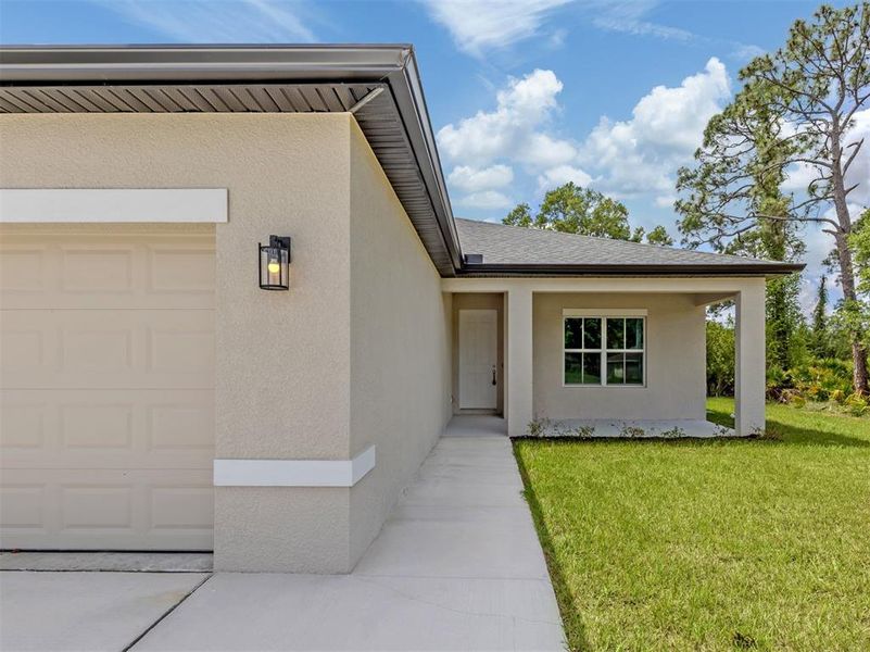 Exterior details and patio area of a home in , North Port (Image 24).